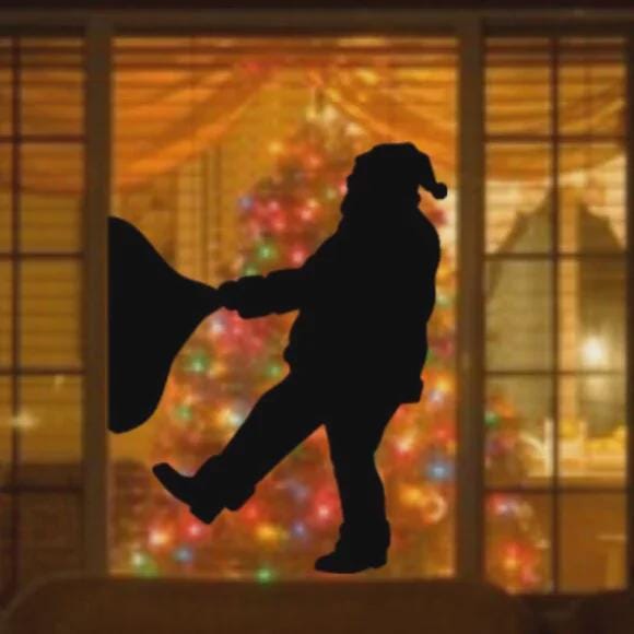 Santa Pulling Heavy Gift Sack Window Decal | Large Reusable Holiday Cling